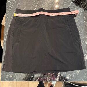 Athleta Black Skort with Zippered front pockets and 2 back pockets size medium